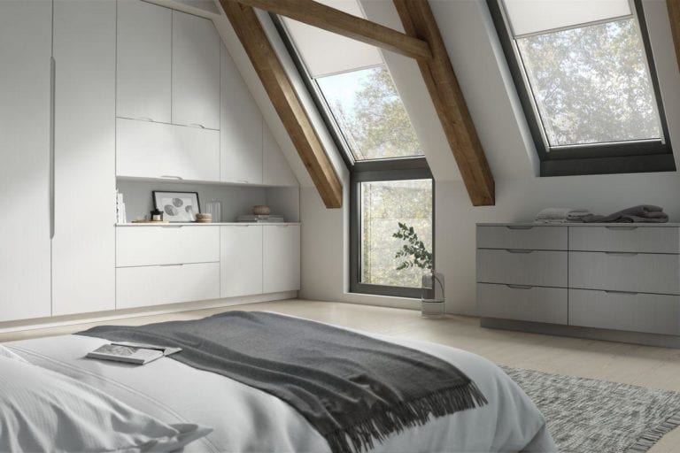 Large, open bedroom with exposed beams, white built in wardrobes & roof windows Goscote Brentford Quadro White Quadro Stone Grey